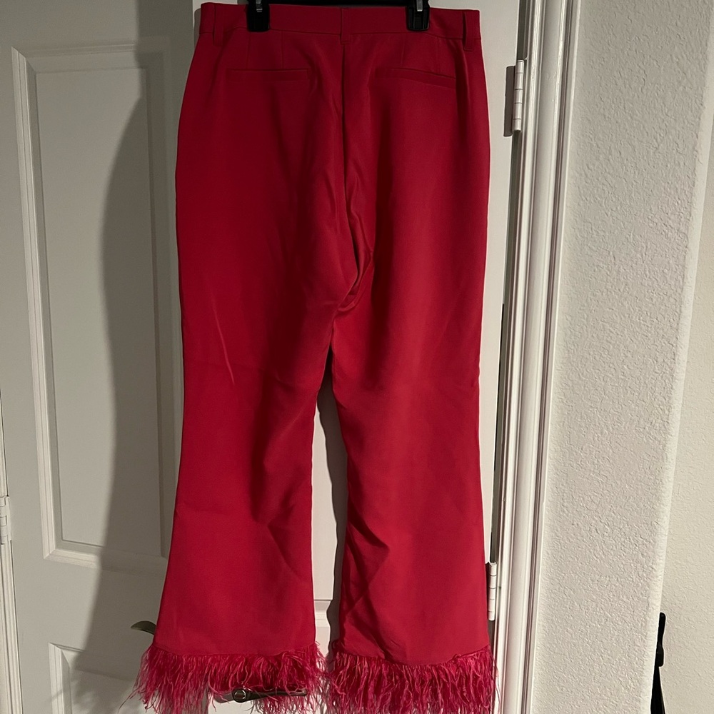 Women pink pants with feathers on the bottom of pants. Fun and unique. - Picture 2 of 7